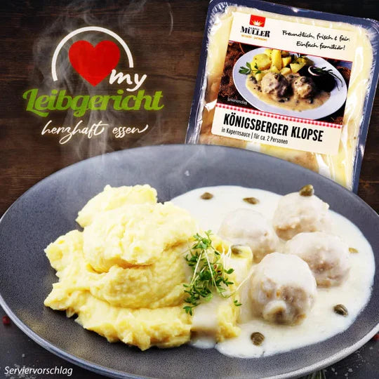 Müller Königsberger Klopse in Kapernsauce, serviert mit Kartoffelpüree auf einem Teller als Serviervorschlag